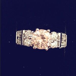 Elegant Sterling silver Ring with pink center stone. Size 8–8.5